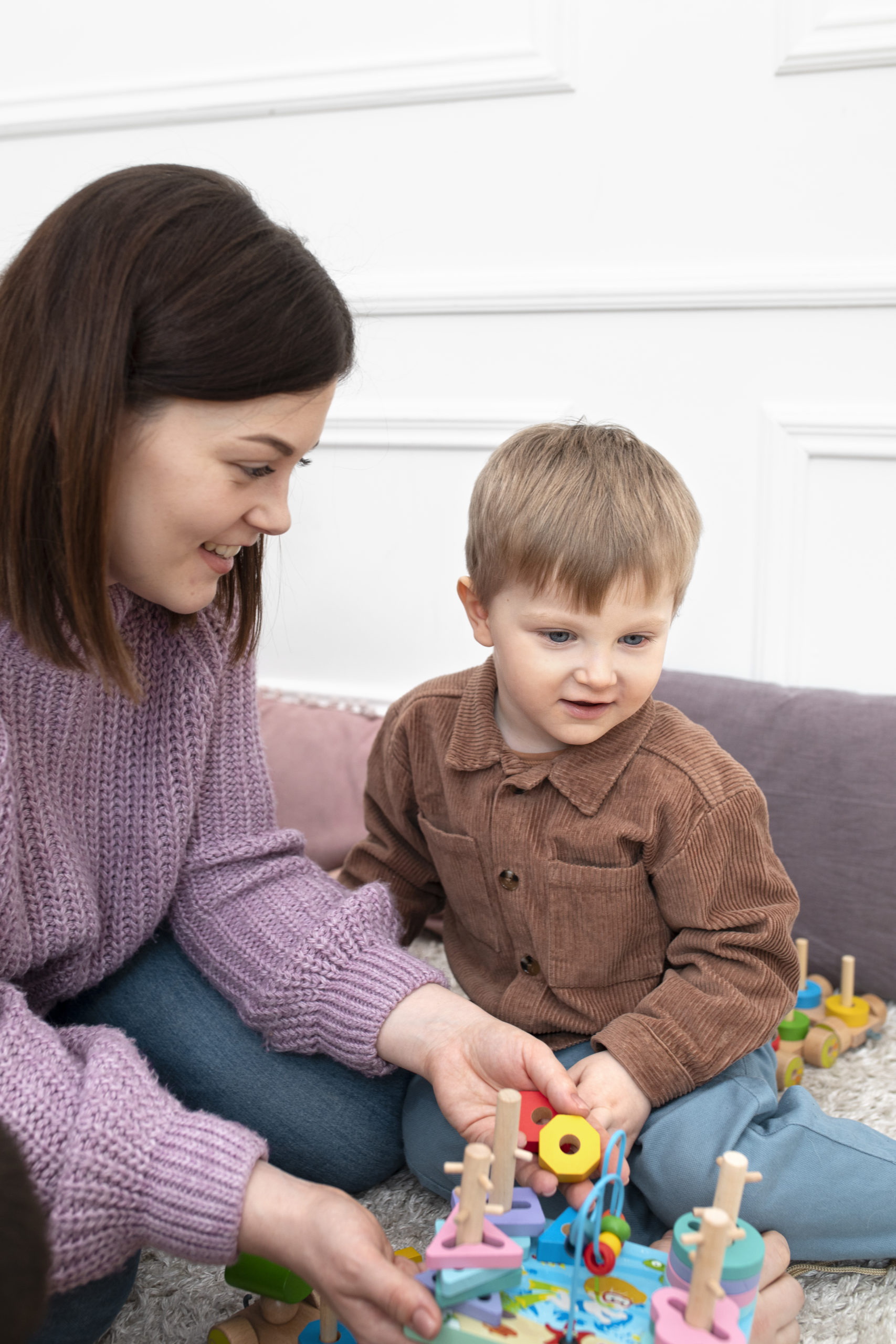 medium-shot-mother-kid-playing-together